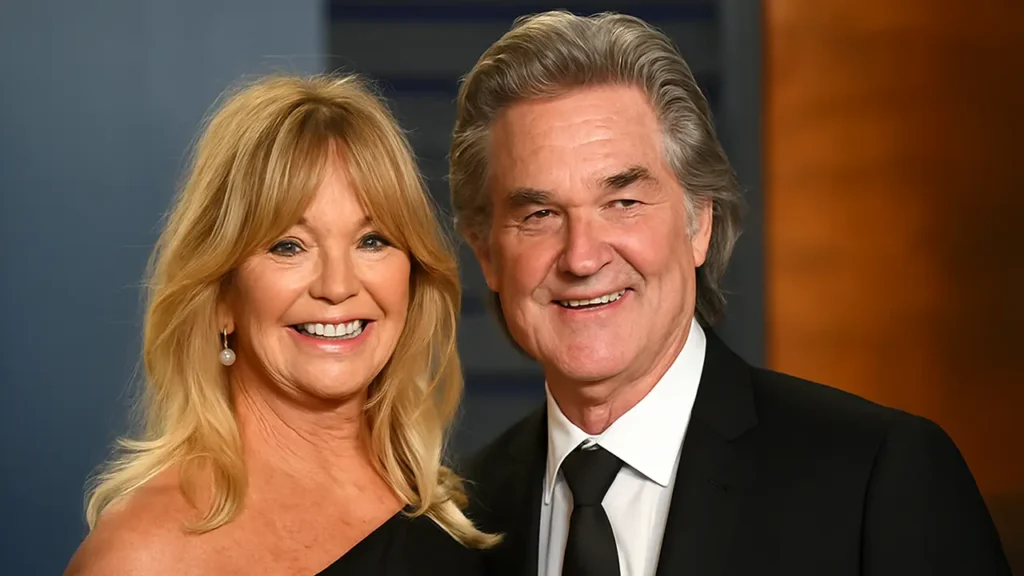 Goldie Hawn and Kurt Russell smiling together at a formal evening event