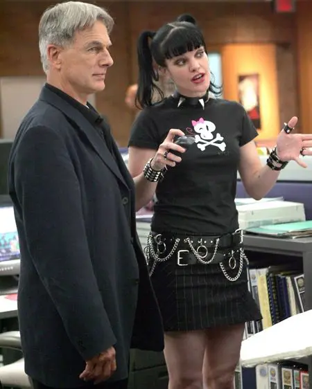 Pauley Perrette as Abby Sciuto talking with Mark Harmon as Gibbs in an NCIS scene