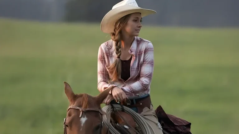 Amber Marshall with her horse at sunset near the Heartland ranch