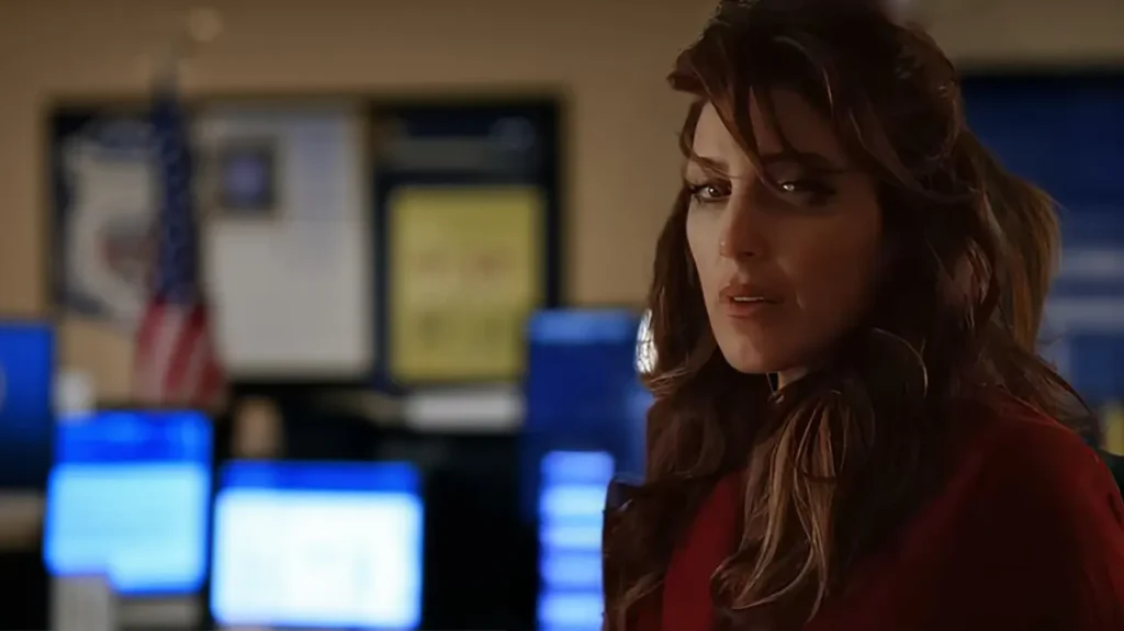 Jennifer Esposito portraying Alex Quinn in a serious moment inside an NCIS office
