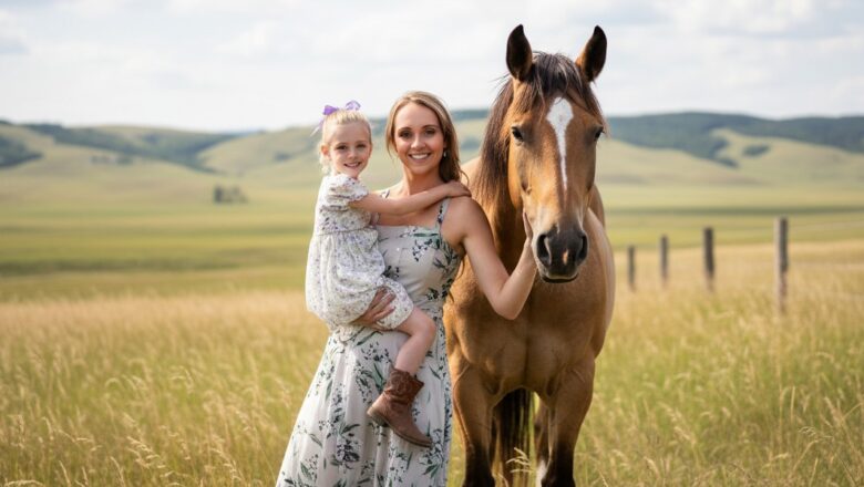 Amber Marshall standing beside a chestnut horse on her Alberta ranch at sunset.