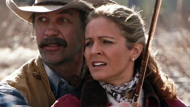 Jack and Lisa from Heartland standing close together outdoors at the ranch