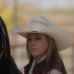 Amy Fleming standing beside a horse at Heartland ranch, calm and focused expression