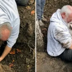 Alan Whitton hugging his missing Jack Russell terrier Mitzi after pulling her out of a fox hole in Essex.
