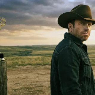 Taylor Sheridan, creator of Yellowstone and Landman, wearing a cowboy hat and looking toward the camera.